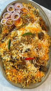 a large plate of food on a table at Mohal's House in Lahore