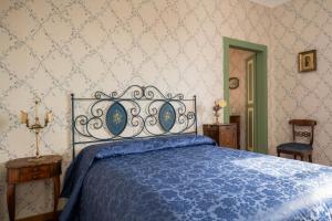 Postel nebo postele na pokoji v ubytování Palazzo Fiorenzi - Dimora storica