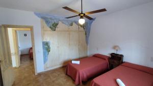 Giường trong phòng chung tại Cortijo de la luna la casita