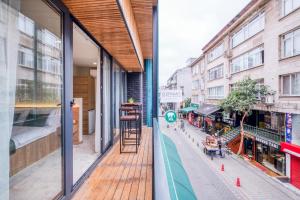 a balcony with a view of a street with buildings at Elephant In The Room Hotel in Istanbul