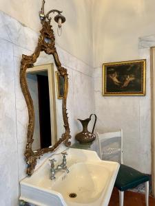 a bathroom with a sink and a mirror at Villa Arnolfini in Capannori