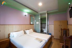 Postel nebo postele na pokoji v ubytování Hotel Mount Paradise