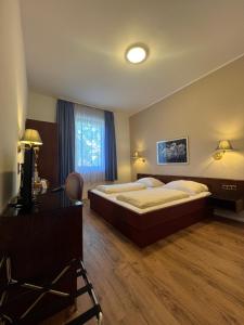 Postel nebo postele na pokoji v ubytování Central Hotel