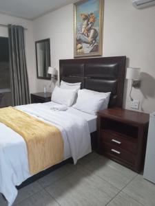 Posteľ alebo postele v izbe v ubytovaní Whitehouse Lodge Benoni