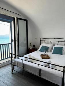 Postel nebo postele na pokoji v ubytování Μεζονέτα - Παραλία Αγία Φωτεινή