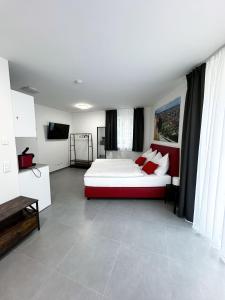 a bedroom with a bed and a television in it at Grazora Living Apartments in Graz