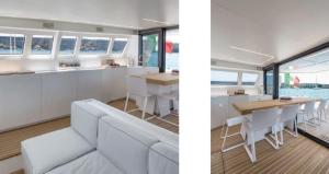 a kitchen and a dining room on a yacht at Luxury catamarano 20 meters in Marina di Portisco
