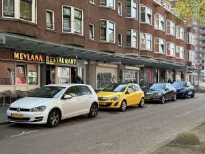 a group of cars parked on a city street at Flex-Inn in Rotterdam