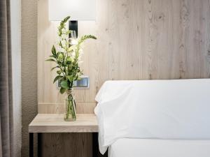 Postel nebo postele na pokoji v ubytování Hotel Albret