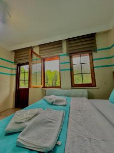A bed or beds in a room at Konak Grand Apart