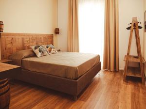 a bedroom with a bed and a ladder and a tripod at U Zuccareddu in Alcamo