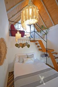 Postel nebo postele na pokoji v ubytování Bungalow Maya en CASA NOMIS CANCUN