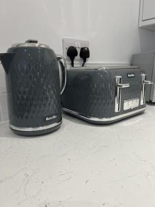 two toasteries sitting on a counter in a kitchen at Beautiful Anfield Family Home in Liverpool