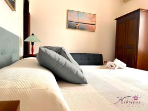 Postel nebo postele na pokoji v ubytování B&B Hibiscus