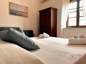 Postel nebo postele na pokoji v ubytování B&B Hibiscus