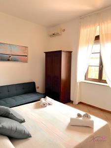 Postel nebo postele na pokoji v ubytování B&B Hibiscus