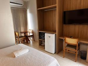 Телевизор и/или развлекательный центр в Hotel Eden