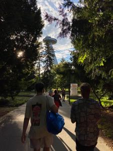 a group of people walking down a path in a park at Urban Elephants Hostel in Bratislava