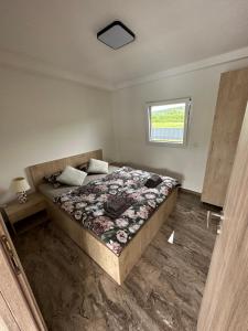 a bedroom with a bed and a window at Terra Solis Bihać Villa 2 in Bihać +20 photos