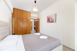 En eller flere senge i et værelse på Seascape in Kos Central