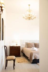 Säng eller sängar i ett rum på White Star Estoril