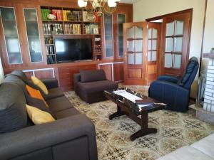 a living room with a couch and a coffee table at Villa Sara in Ribadeo