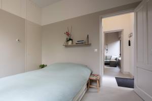 Ένα ή περισσότερα κρεβάτια σε δωμάτιο στο Cosy Dutch Delight Apartment