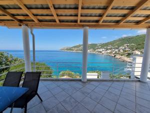 a view of the ocean from a house balcony at Matovic Apartments in Dobra Voda