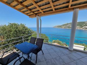 a balcony with a view of the ocean at Matovic Apartments in Dobra Voda