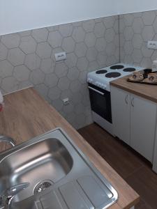 Kuchyň nebo kuchyňský kout v ubytování Apartman-Glavas I