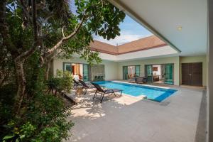 an image of a villa with a swimming pool at VILLA BOND| 3 Bedrooms | Private Pool | 3 min to Naiharn Beach in Rawai Beach