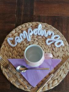a basket with a coffee cup and the word congratulations at Agriturismo Campolungo in Sant'Ermo