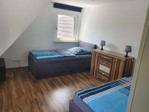 Postel nebo postele na pokoji v ubytování Ferienwohnung Stephanshausen
