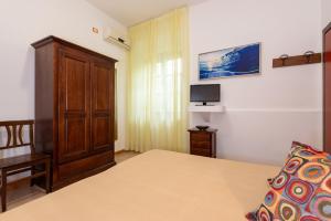 Postel nebo postele na pokoji v ubytování B&B Hibiscus