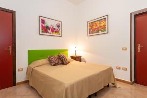 Postel nebo postele na pokoji v ubytování B&B Hibiscus