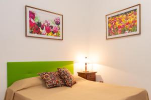 Postel nebo postele na pokoji v ubytování B&B Hibiscus