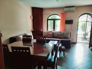 a living room with a table and a couch at Apartman Aleksa in Bela Crkva