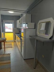 Kuchyň nebo kuchyňský kout v ubytování Zoé apartman