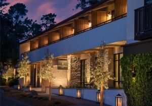 an exterior view of a building at night at Stilwell Hotel in Carmel