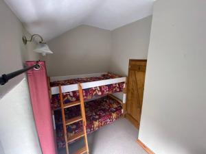 a small attic room with a shelf with dolls at Mill Cottage, Upper Hulme in Upper Hulme +26 photos