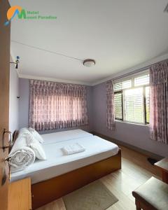 Llit o llits en una habitació de Hotel Mount Paradise