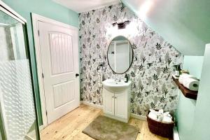 a bathroom with a sink and a mirror at Fin's Studio, Fundy Park in Alma +37 photos