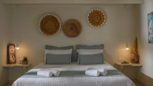 Кровать или кровати в номере Michelangelo Beach Villa