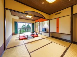 Postel nebo postele na pokoji v ubytování Hotel Green Plaza Hakone