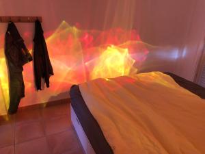 a bedroom with a bed with a colorful blanket at CasitaCalera in Calera