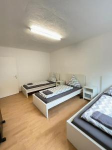a room with three beds in it at Holiday Apartment Adenau in Adenau