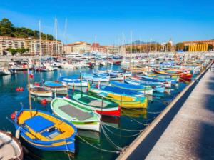 a bunch of boats are docked in a harbor at Riquier Résidence in Nice