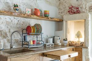 Kuchyň nebo kuchyňský kout v ubytování Luxury Suite Of Ostuni