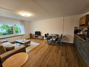a living room with a couch and a table at Ferienwohnung Medina in Bad Wildungen