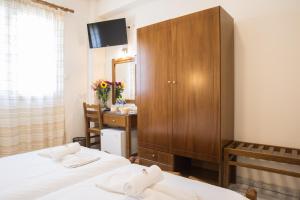 Letto o letti in una camera di THOLOS HOTEL